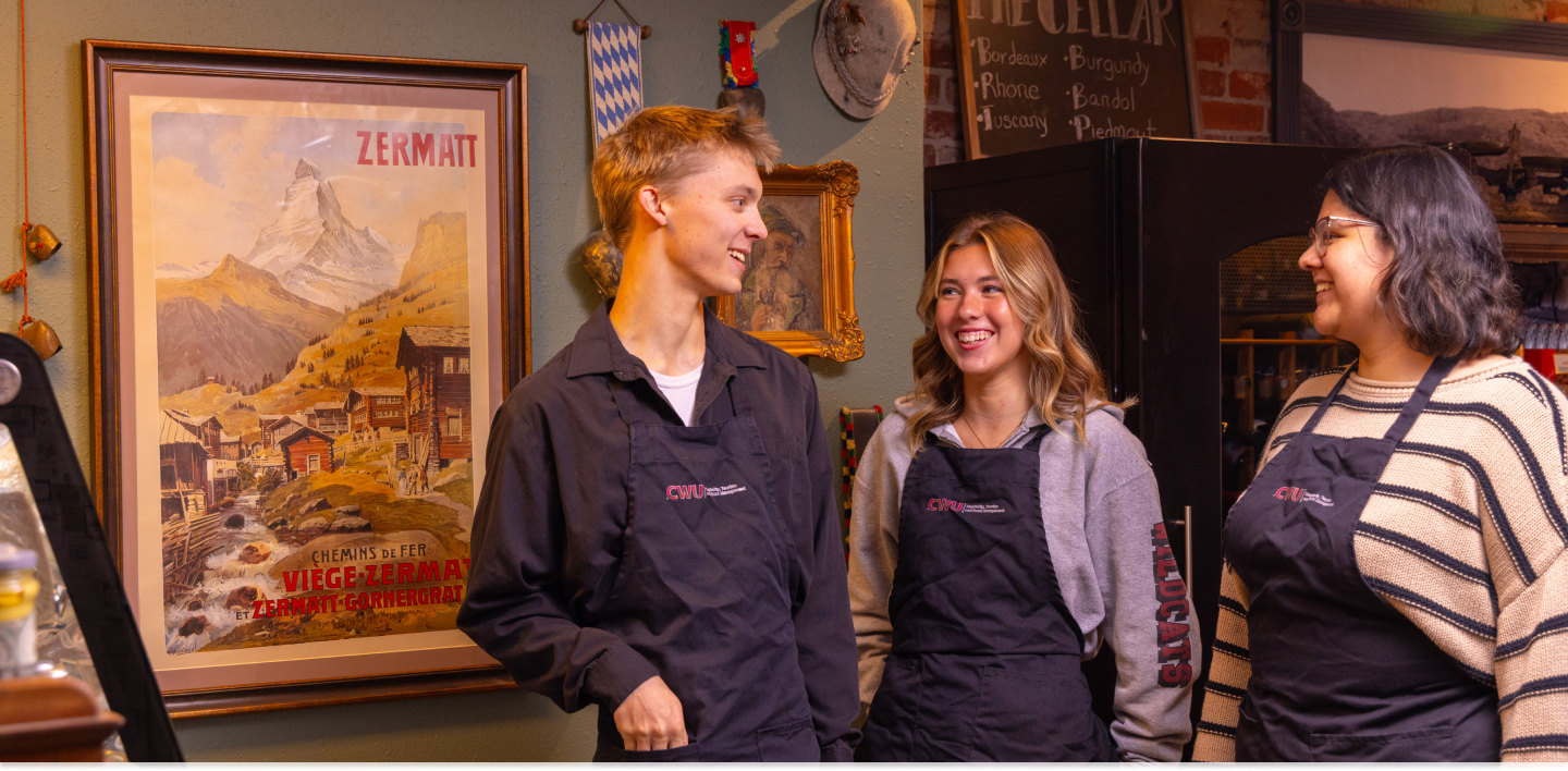 Students working in the tourism industry, laughing.