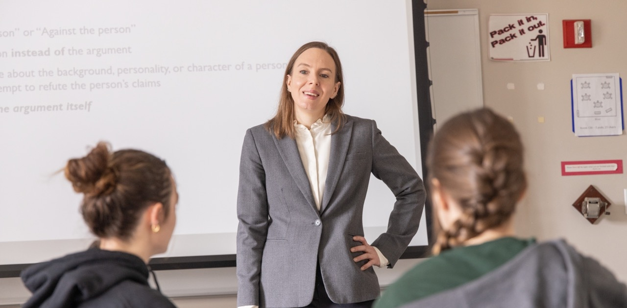 Professor at the front of the classroom lecturing.