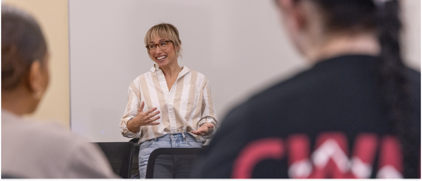 Professor leading a group discussion during class. 