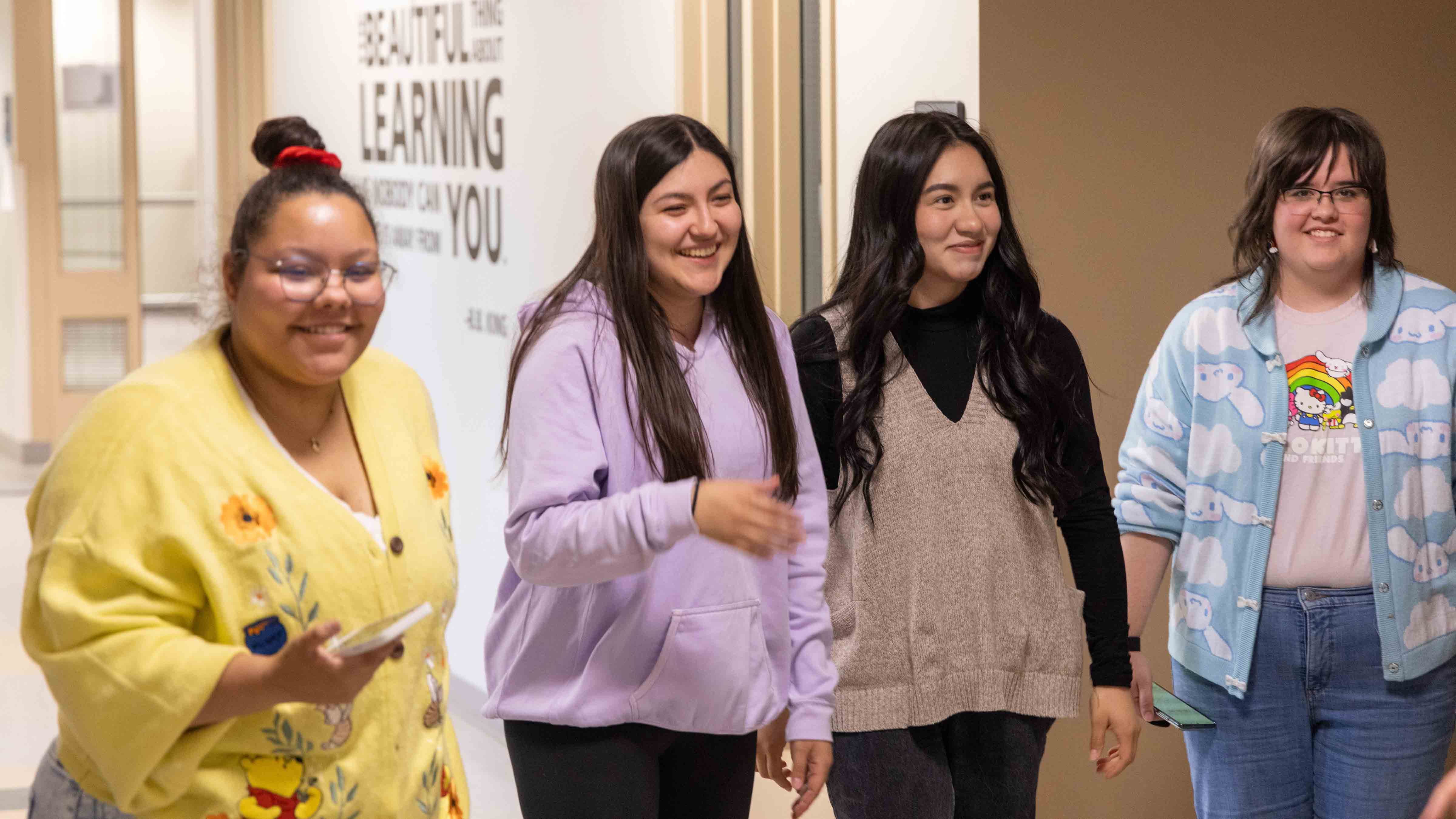 four students smilling