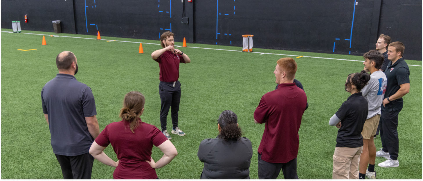 Student explaining to other students a concept in a field.