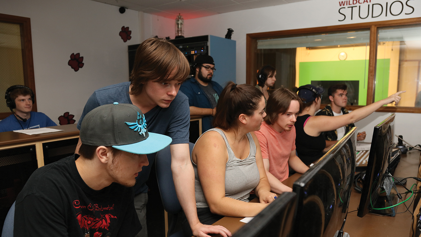 Students working together in a computer lab on film projects