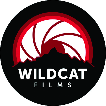 Icon for Wildcat Films, with a mountain outline and a film camera shutter in the middle