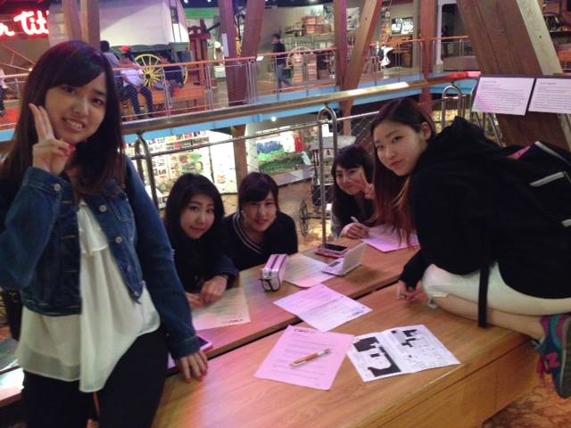 5 students smiling at the museum.