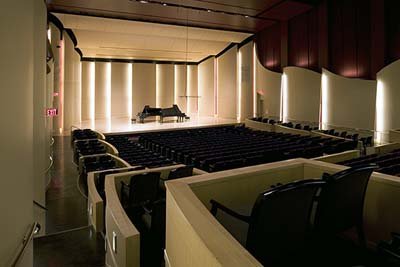 Photo of the CWU Concert hall from the upper most corner in the rear of the hall. Two 9 foot Steinway D grand pianos are on the stage.
