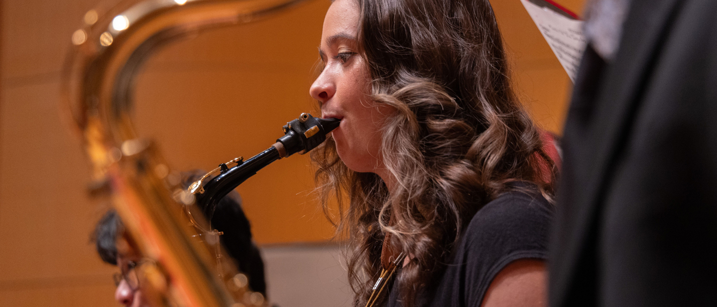 Closeup image of a saxophone player performing in afternoon of jazz.
