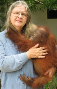 Dr. Birute with an orangutan