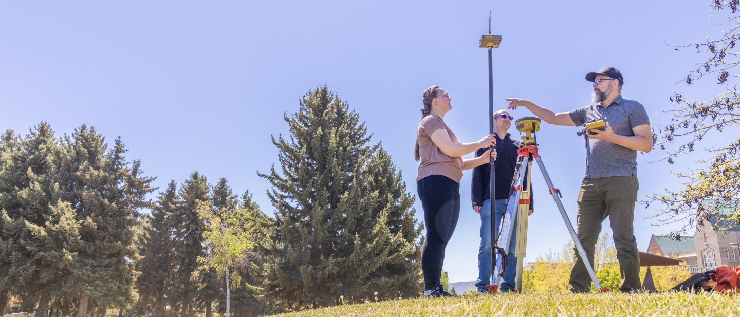 Student and instructors using a RTK GNSS base station and receiver