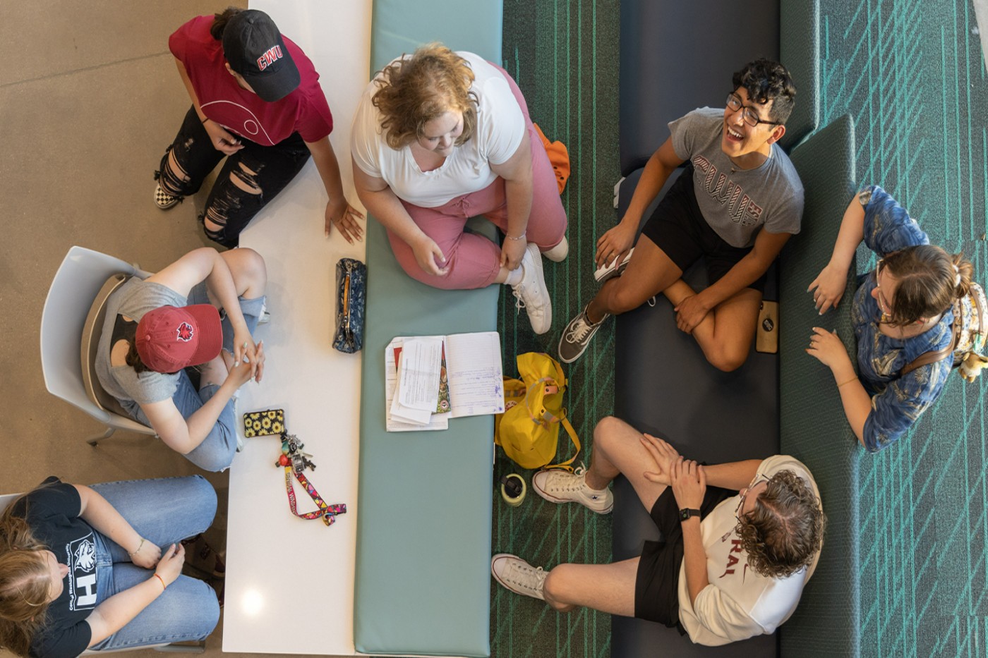 Top down image of students laughing and talking. 
