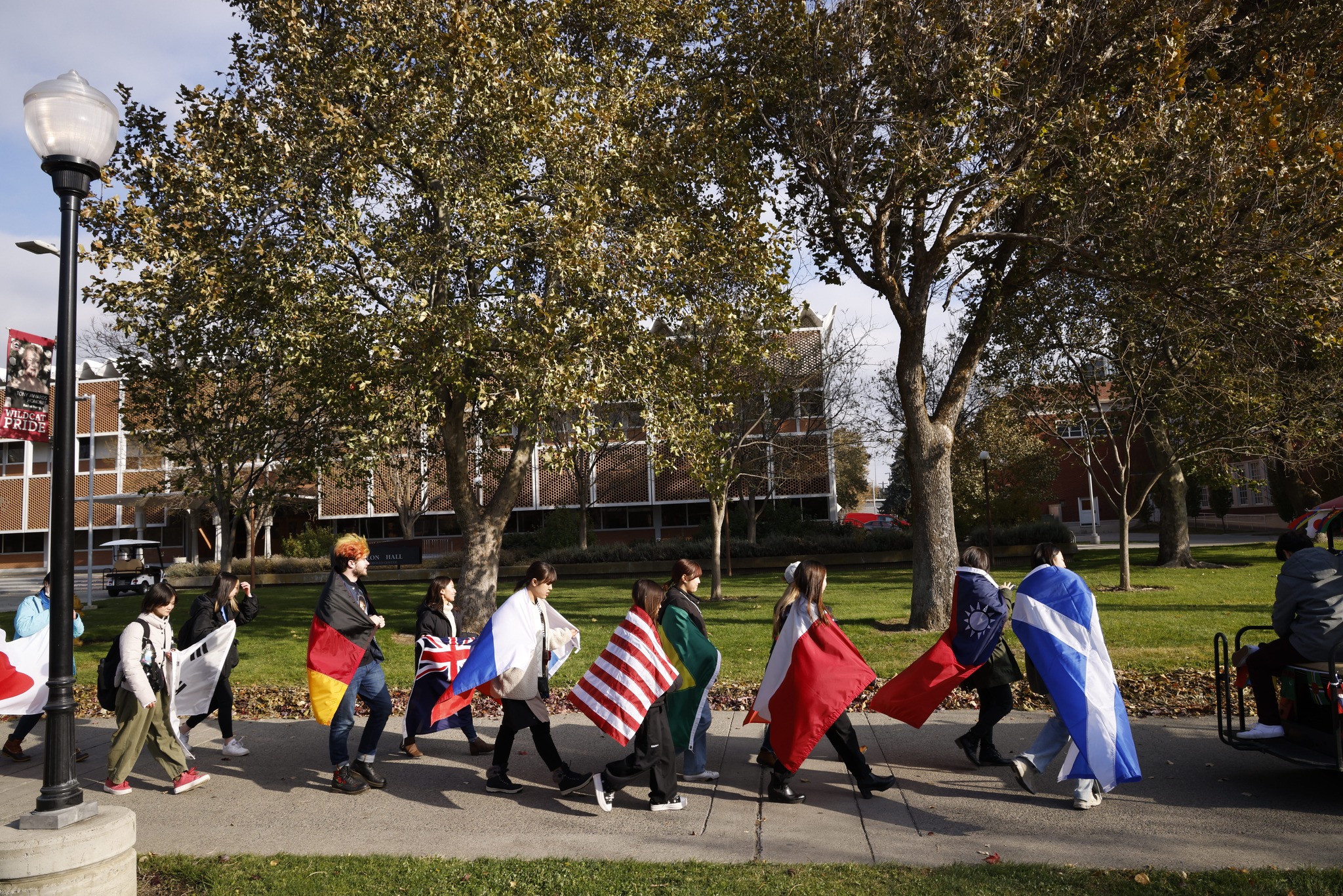 Parade of Flags. In celebration of international education week, students, staff and faculty walk around campus holding flags from around the world.