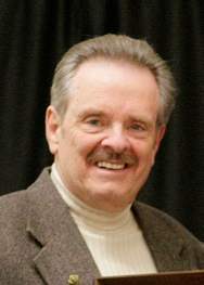 A headshot of David Poushey.