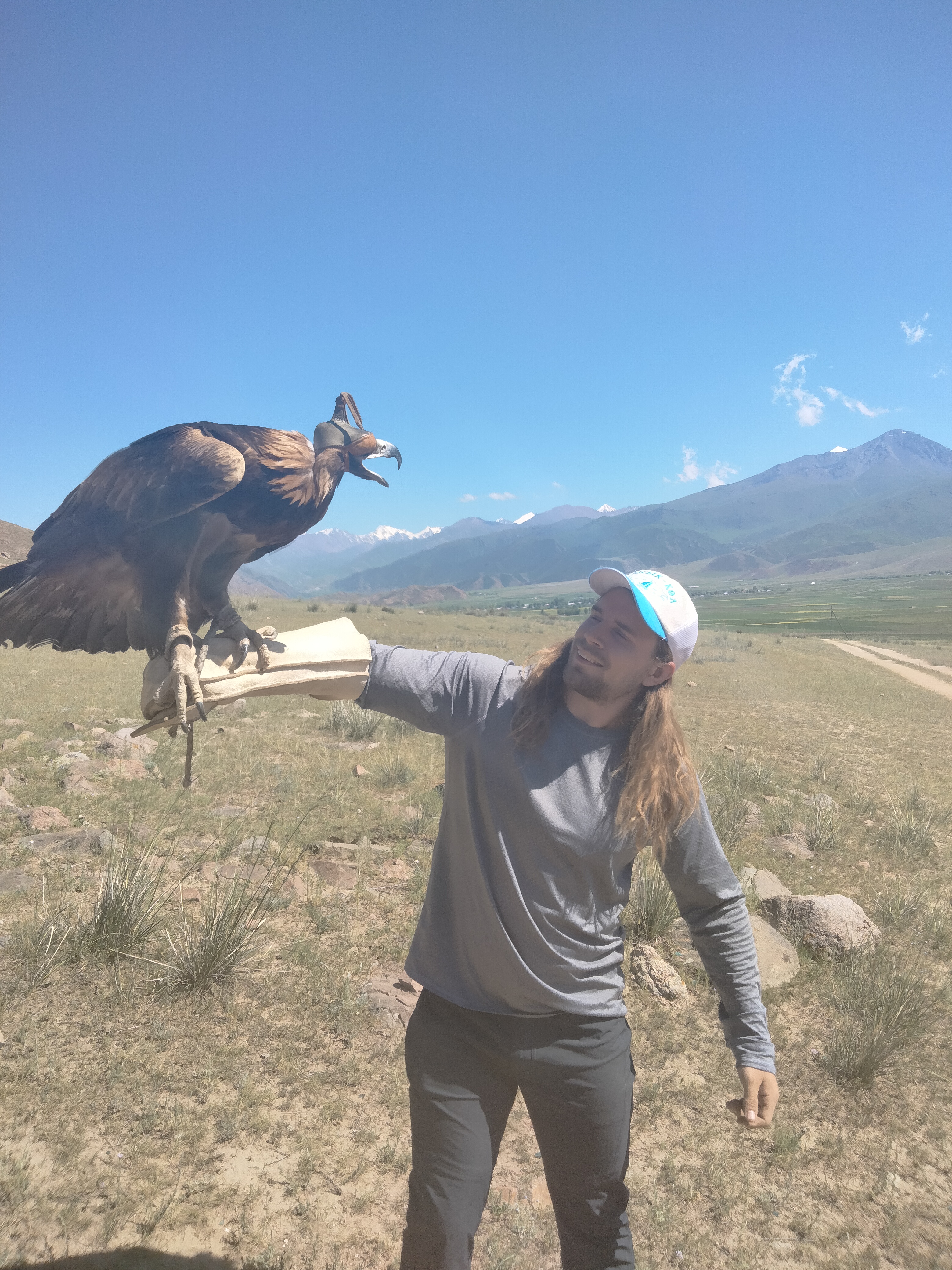 Josh Johnson with a hawk in Kyrgyzstan
