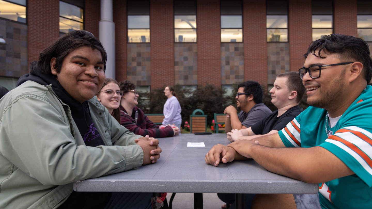 Two students talking during an orientation event.