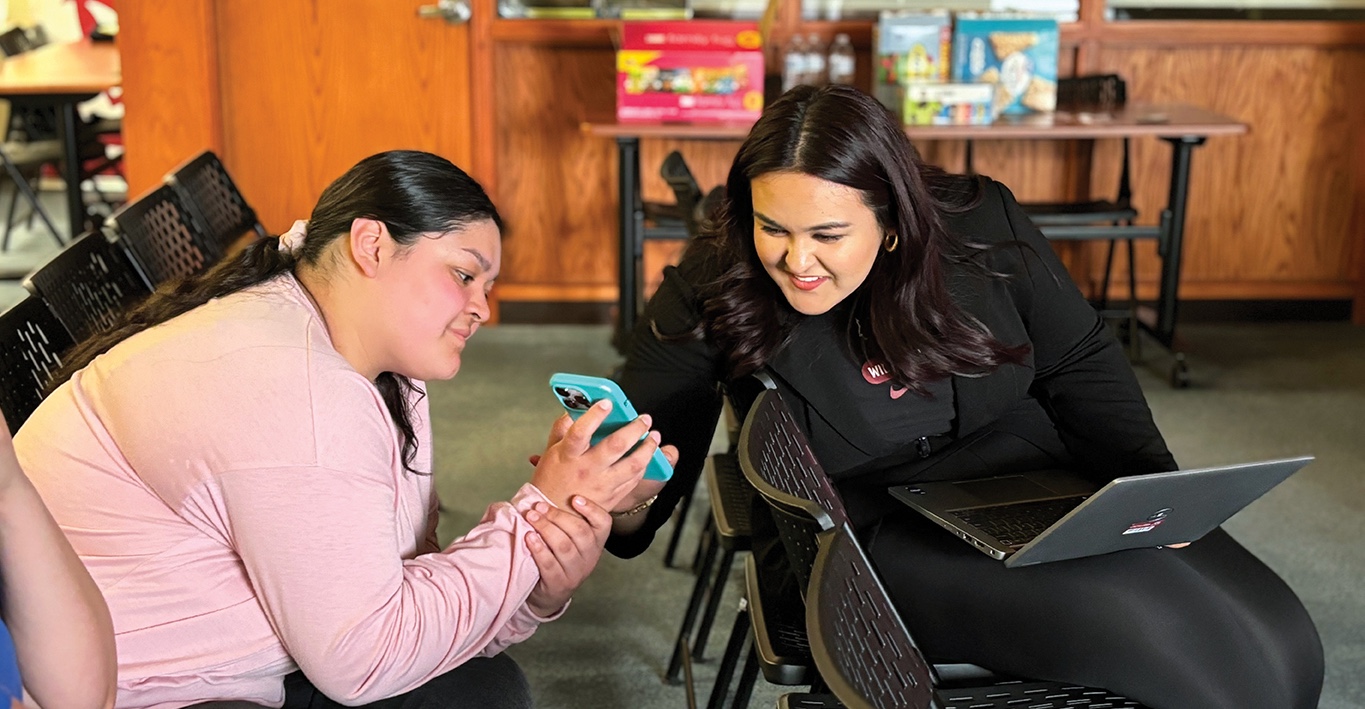 A Yakima Admissions staff member helps a student