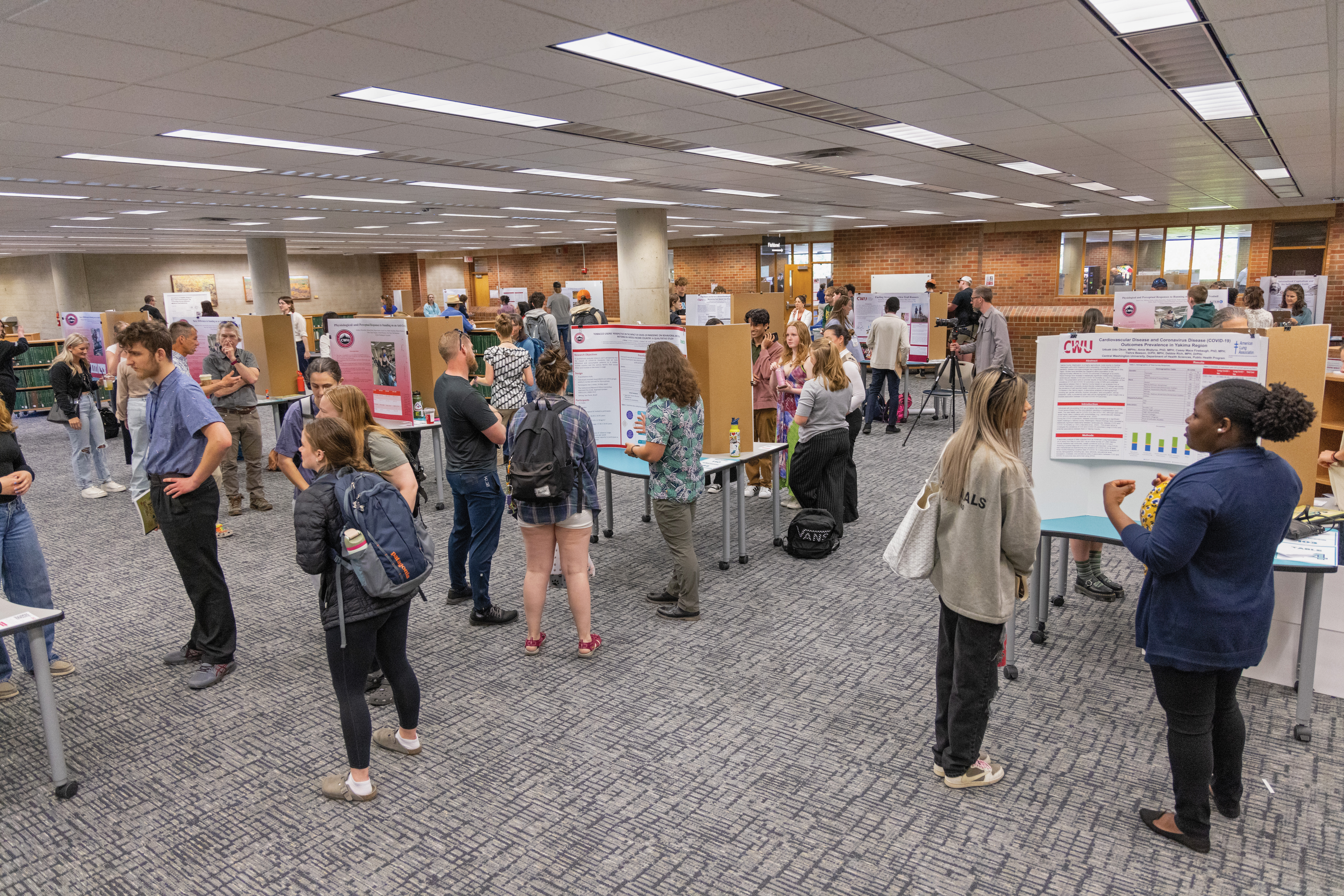 Large presentation space with many students showing off their work.