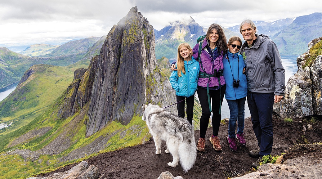 Susan Kaspari and her family in front of a mountain peak in Norway
