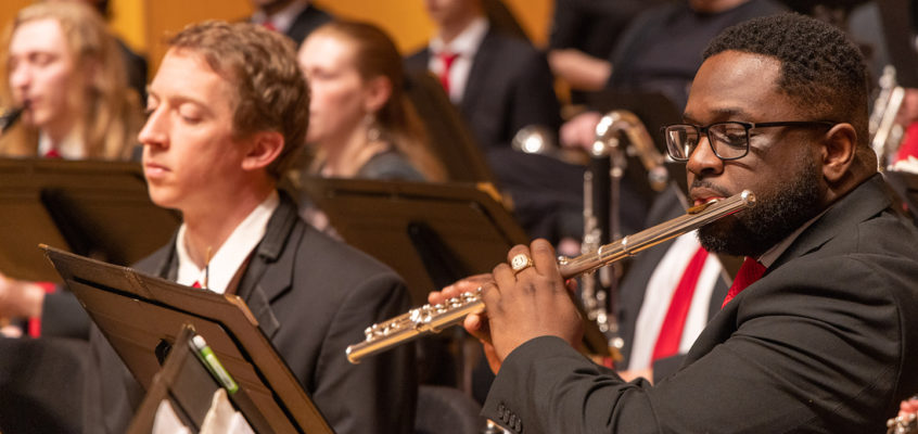 A group of musicians playing their different instruments.