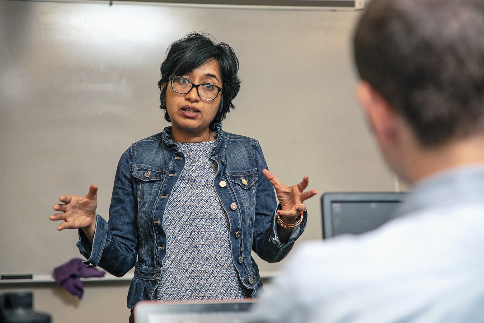 Photo of Sayantani Mukherjee teaching a class.