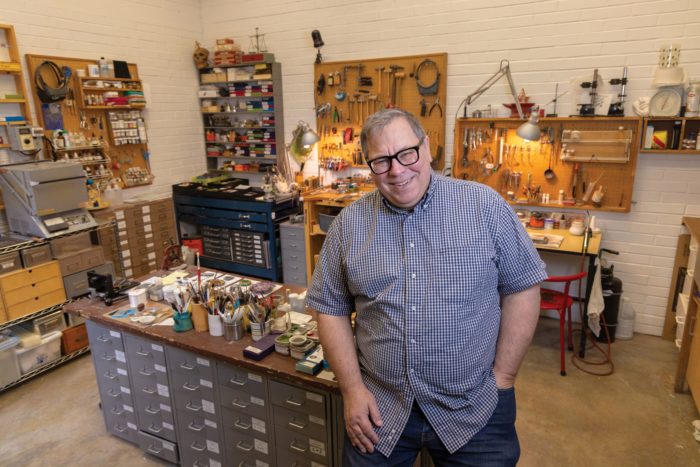 Keith Lewis in his jewelry making workshop
