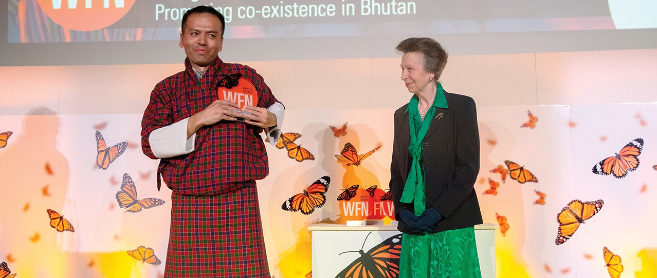 Photo of Kuenzang Dorji accepting the Whitley prize for his conservation work