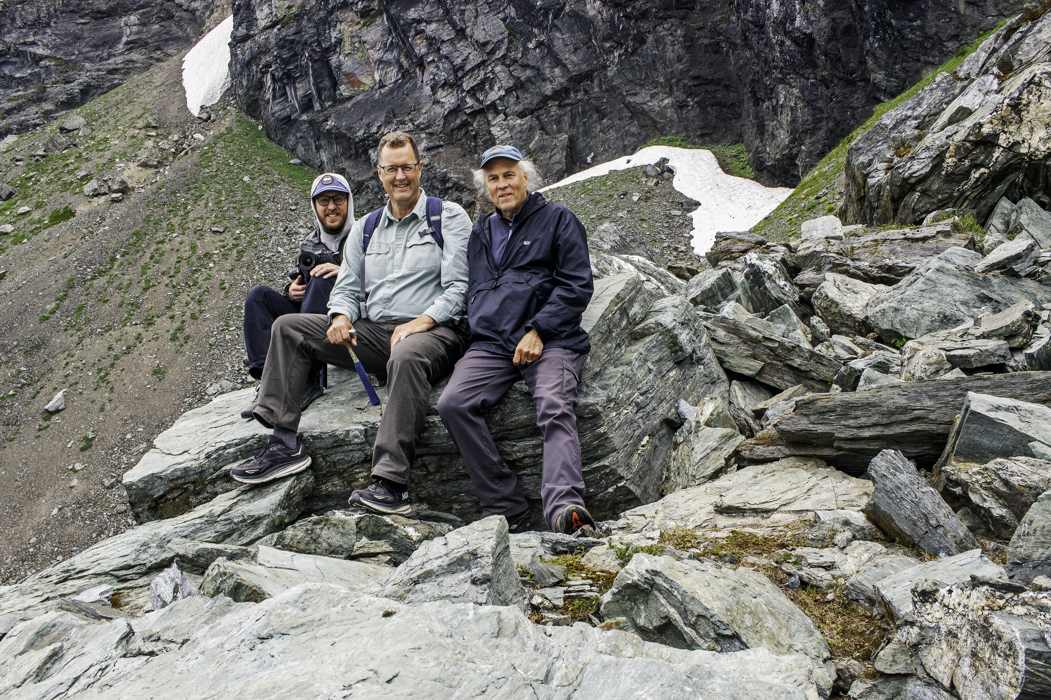 Photo of Brady Lawrence, Nick Zentner, and Gary Paull on a mountainside.