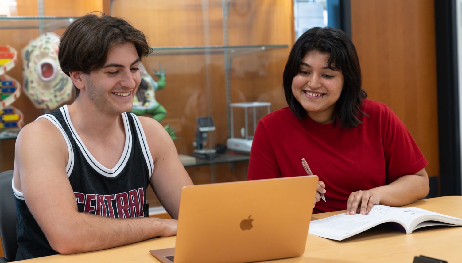 Two students studying together in a classroom