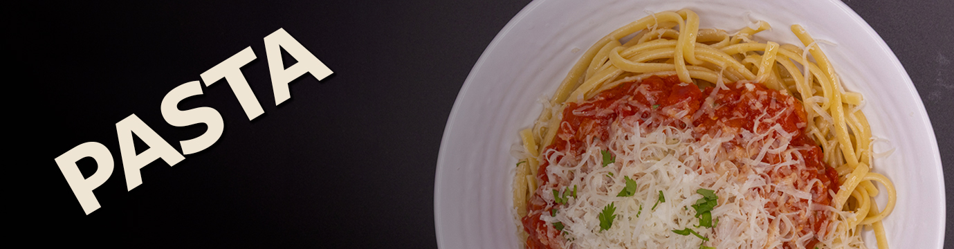 A delicious plate of pasta with fresh basil and shaved parm.