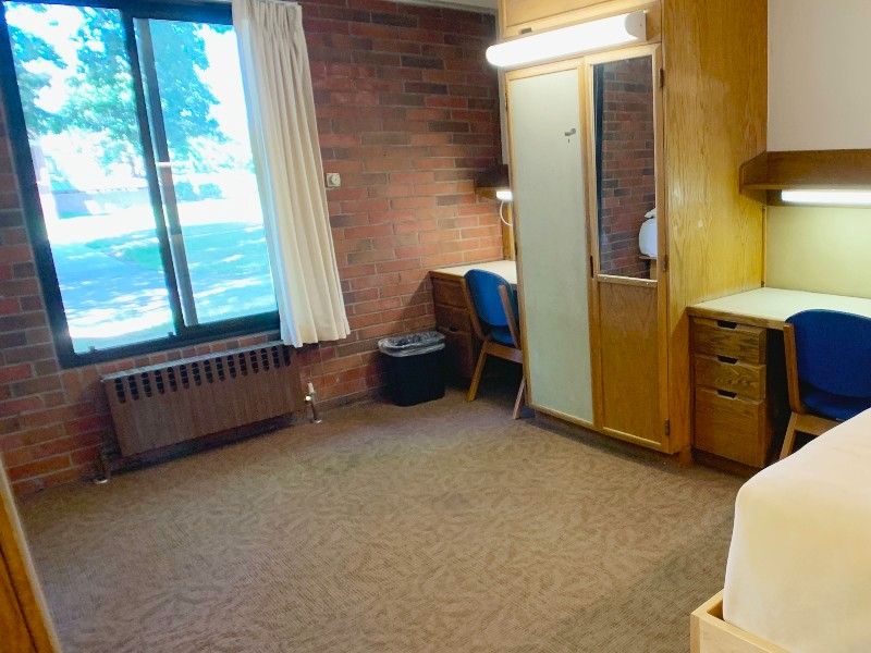 Window, desks, and bed
