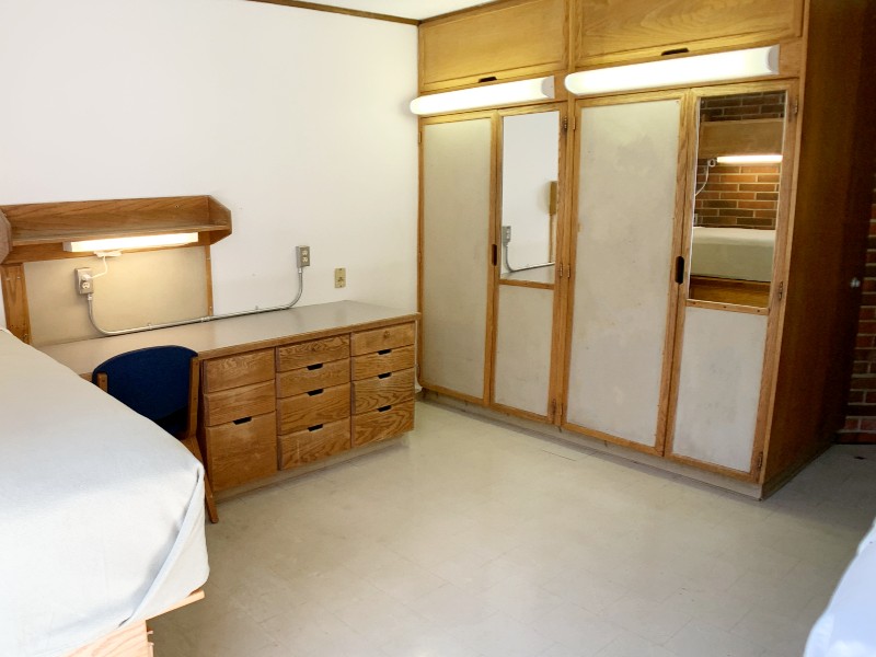 Desk next to two closets