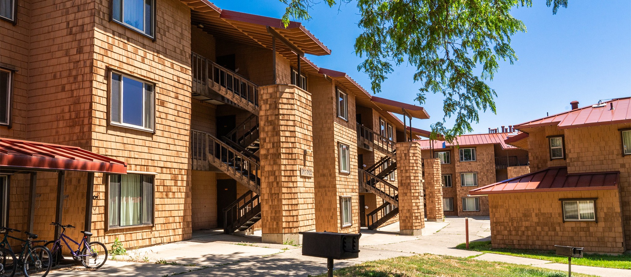 Two story apartment complex with cedar shingle siding