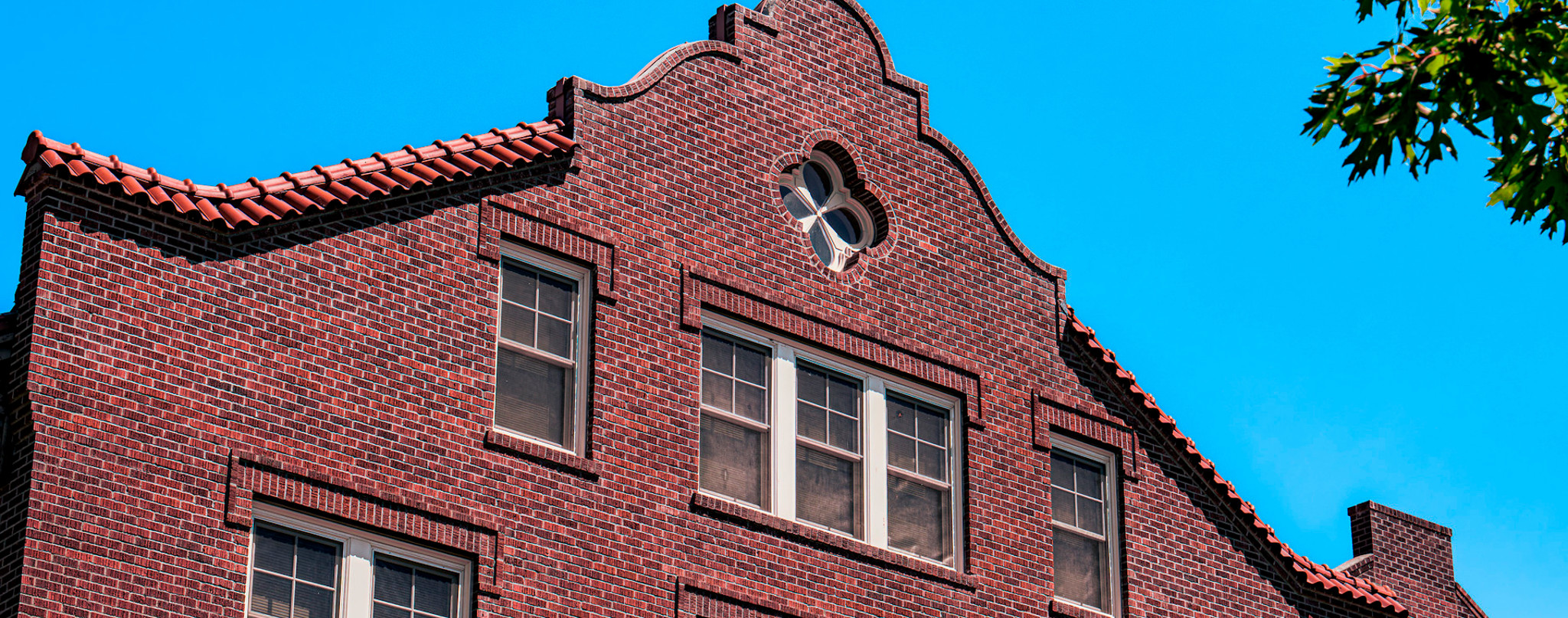 Ornate brick roof and terracotta tiles on Sue Lombard Hall