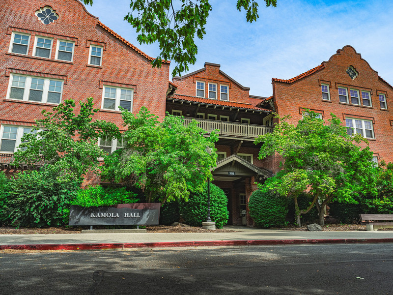 4-story historic brick residence hall with terracotta roof tiles