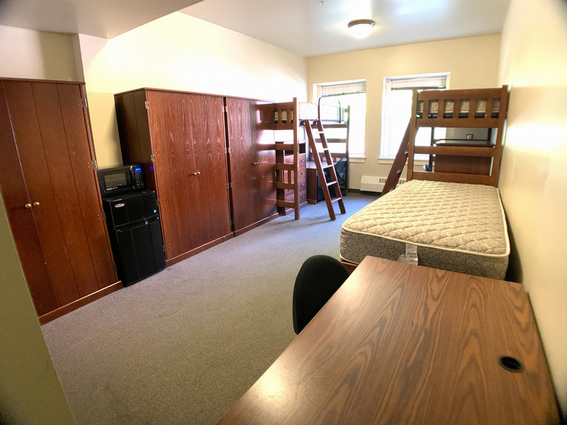 Triple room with two lofted beds and a captain's bed