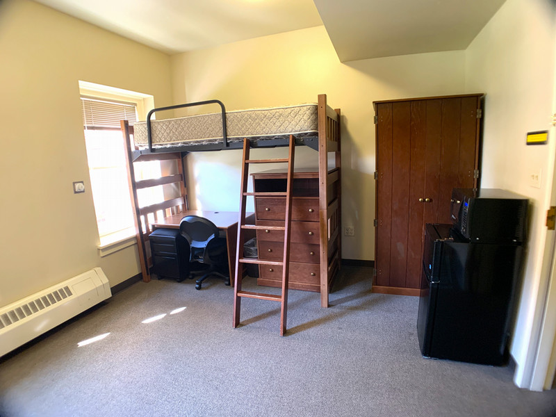Lofted bed with a desk underneath