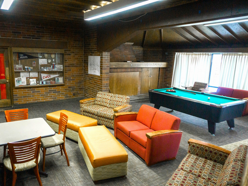 Lounge with pool table, couches, and an accessible ramp