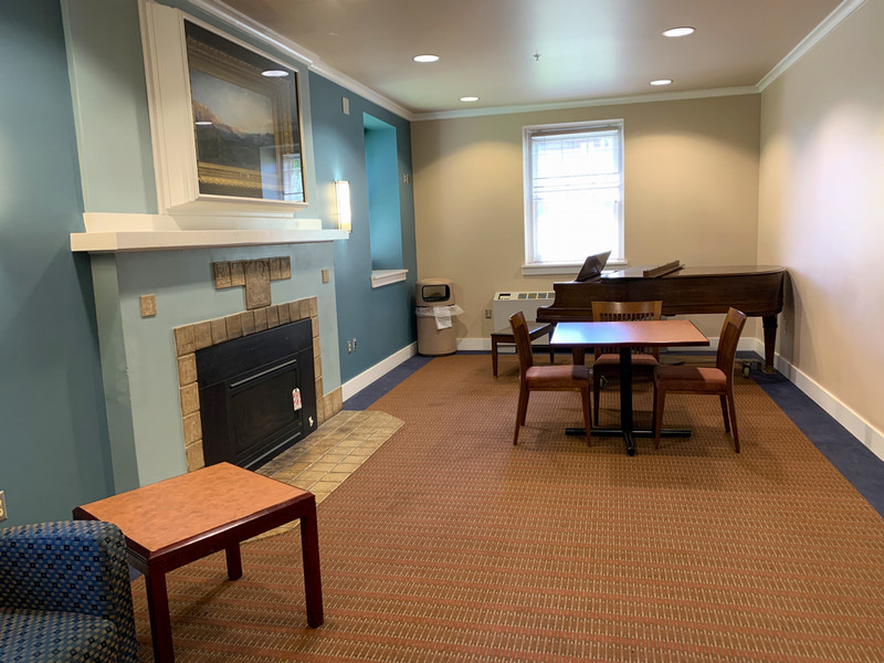 Historic lounge with piano and TV