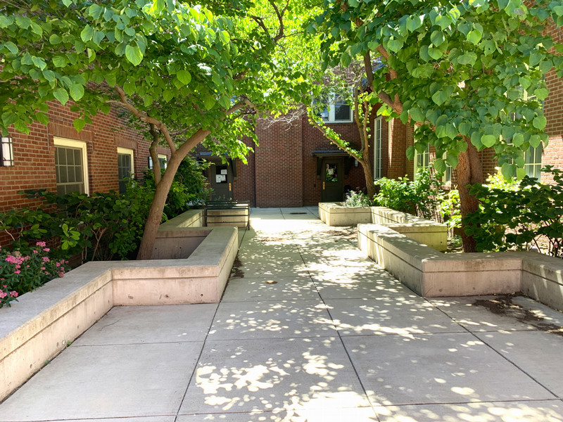 Historic 4-story brick residence hall with back garden area