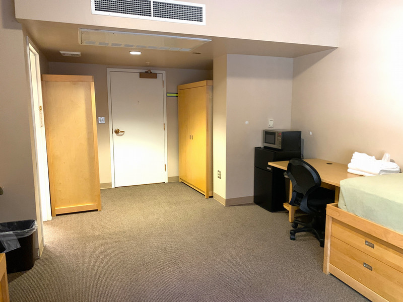 Two desks, two closets, and the entrance door