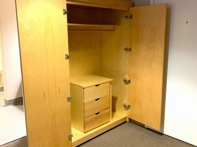 Closet with a hanging rod and shelves