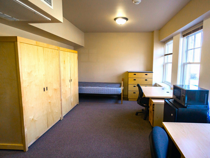 Two beds, two desks, and a window
