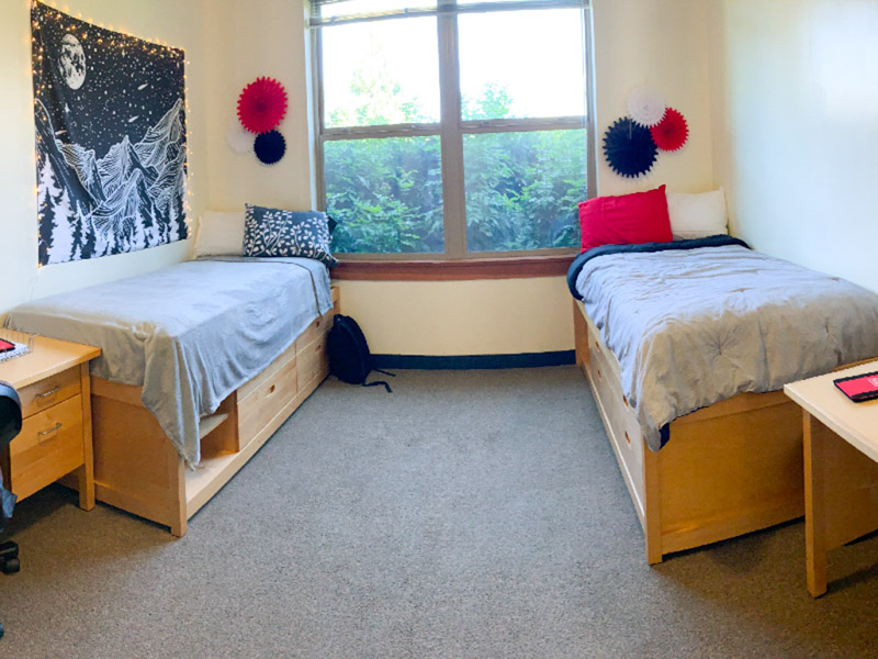 Double room with two beds, desks, and chairs