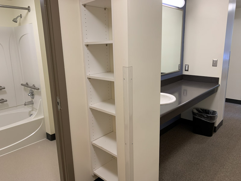 Bathroom area with sinks and a bathtub