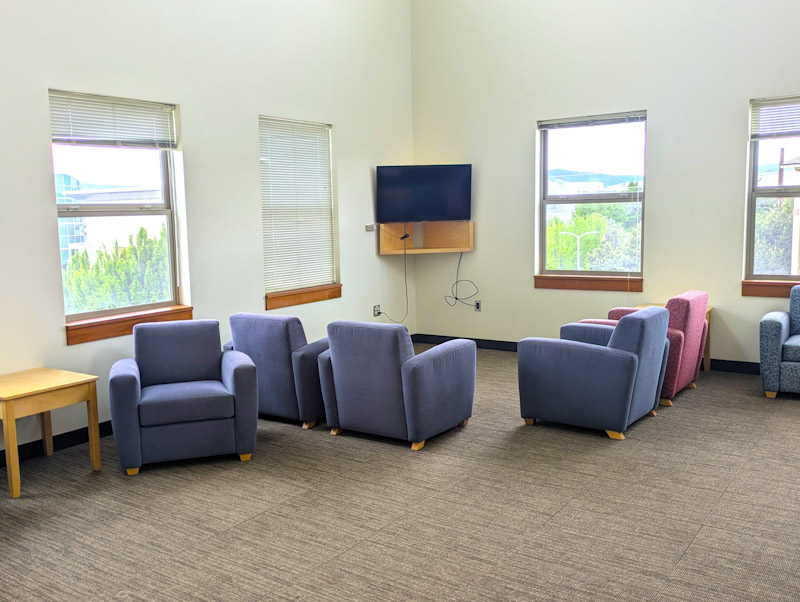 Lounge with chairs and a TV