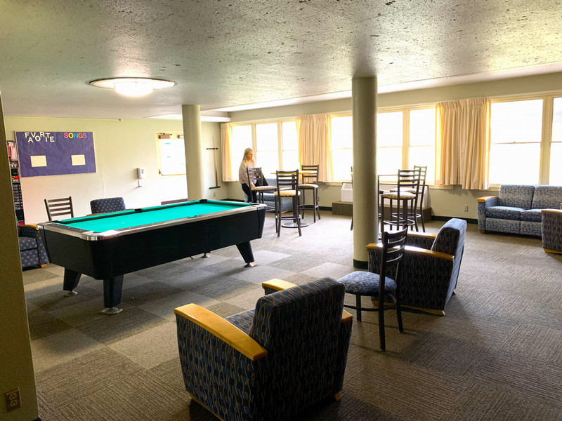 Lounge with couches, chairs and a pool table