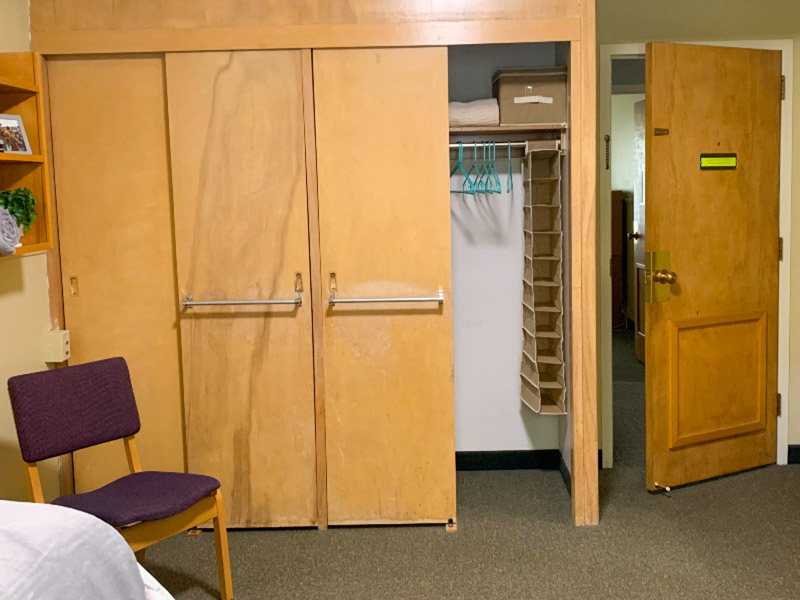 Double closet with hanging bar and top shelf
