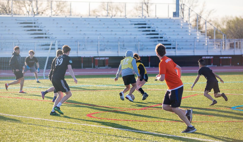 Students playing soccer